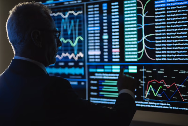 Executive analyzing a revenue intelligence dashboard with real-time business performance and forecasting metrics